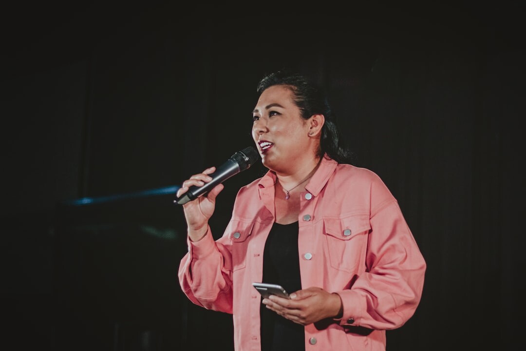 person giving speech on stage