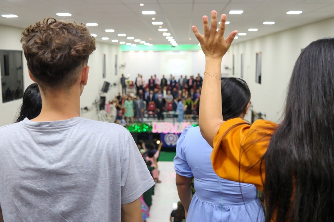 Diverse group of Brazilian adults sitting in a circle having an open conversation in a bright room