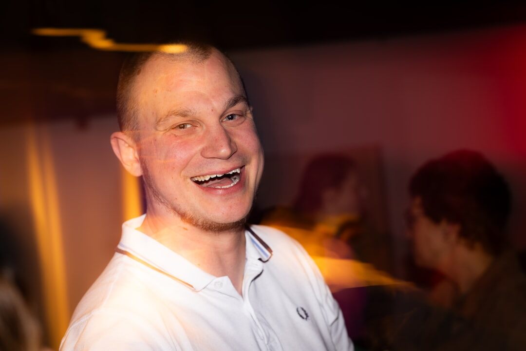 man smiling during talk